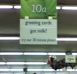 Supermarket aisle 10a contains Greeting cards, Got milk? and Try our 30 min photo.