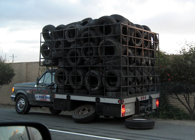 Truck full of tires… changing its tire!