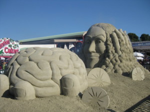 A giant sand sculpture of a brain and Weird Al's head.