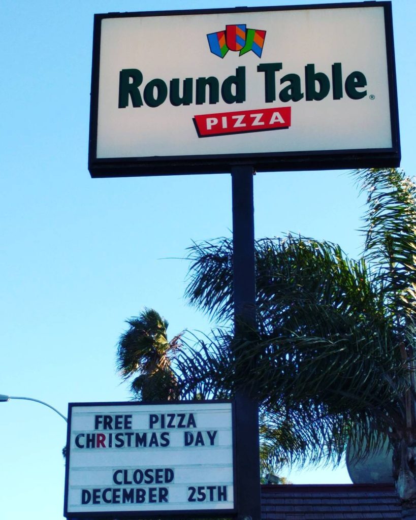 Sign: Free pizza on Christmas Day! Closed Dec. 25.