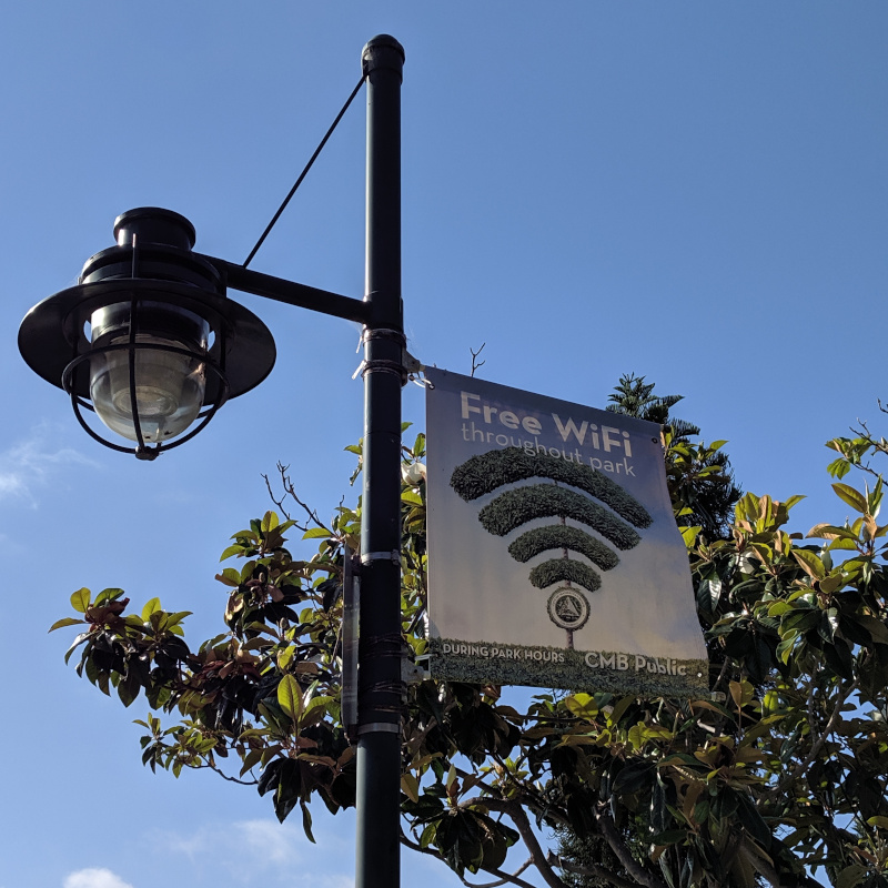 Sign advertising free WiFi in the park.