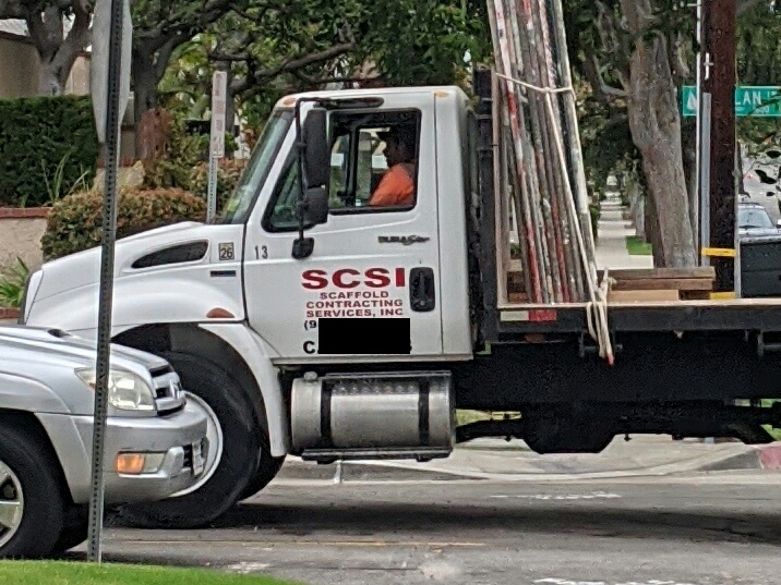 A truck cab labeled SCSI: Scaffold Contracting Services, Inc.