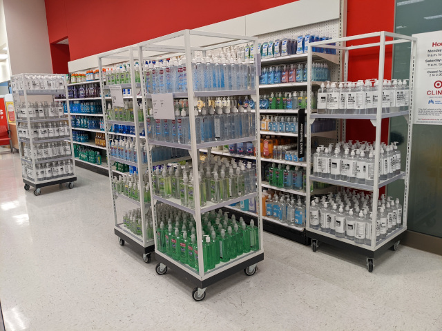 Shelves and shelves and rolling carts full of hand sanitizer bottles.